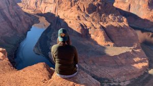 Antelope Canyon Tours - Articles 26 woman in hat overlooking horseshoe bend